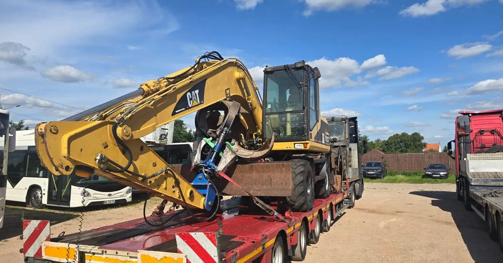 Caterpillar M312 - Pelle sur pneus: photos 2 Caterpillar M312 - Pelle sur pneus: photos 2