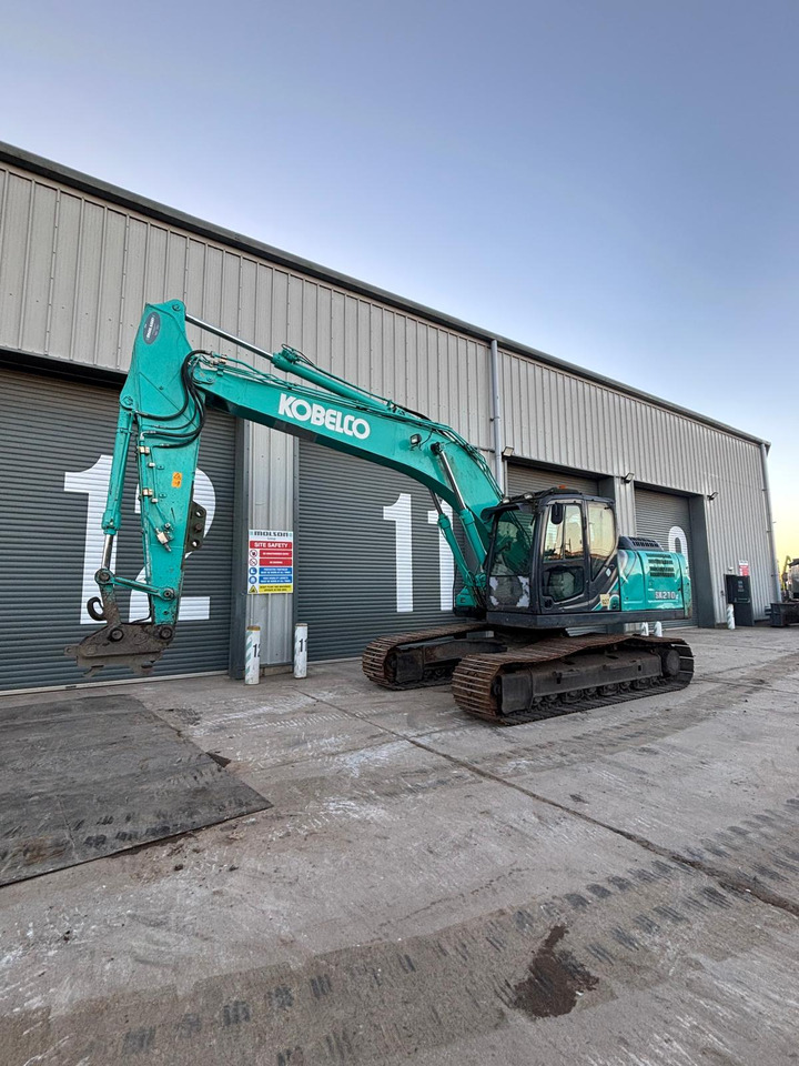 Kobelco SK210LC-10 - Pelle sur chenille: photos 1 Kobelco SK210LC-10 - Pelle sur chenille: photos 1