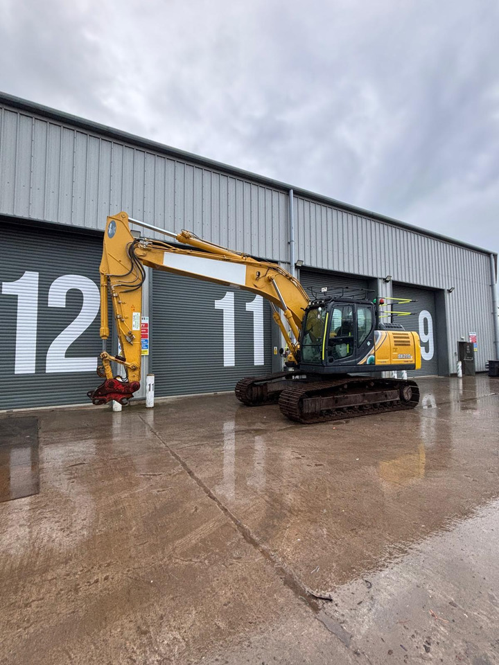 Kobelco SK210LC-10E - Pelle sur chenille: photos 1 Kobelco SK210LC-10E - Pelle sur chenille: photos 1