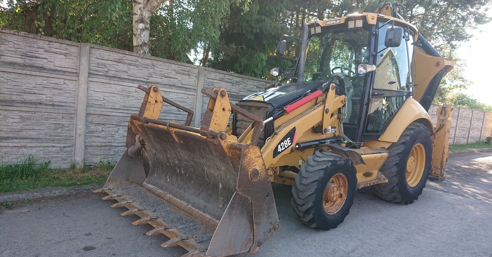Caterpillar - Tractopelle: photos 1 Caterpillar - Tractopelle: photos 1