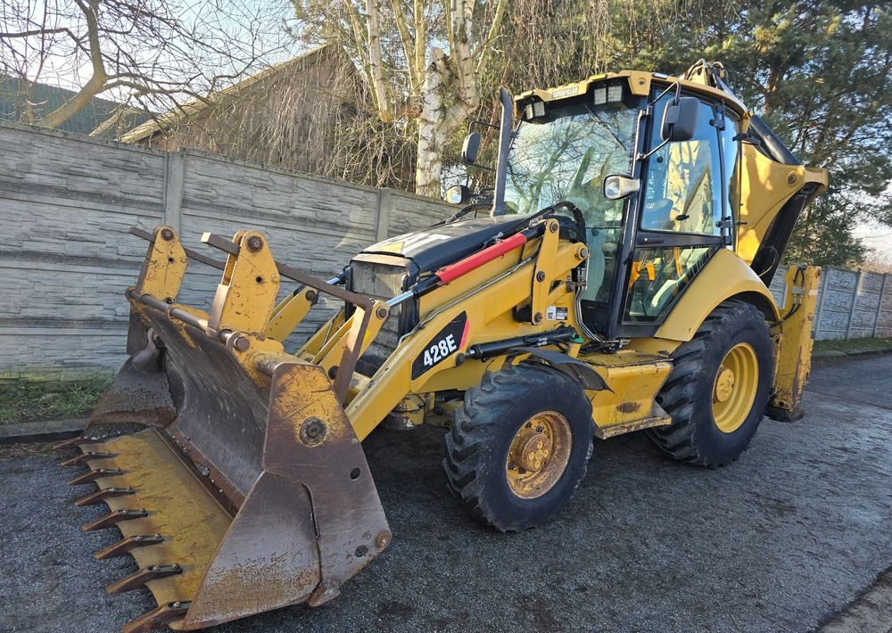 Caterpillar - Tractopelle: photos 1 Caterpillar - Tractopelle: photos 1