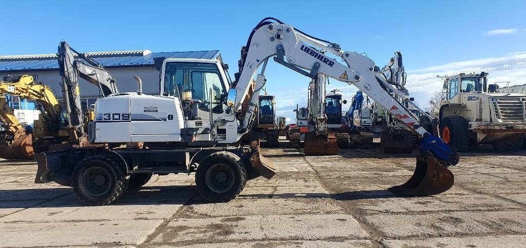 Liebherr A 309 Litronic - Pelle sur pneus: photos 4 Liebherr A 309 Litronic - Pelle sur pneus: photos 4