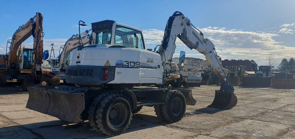 Liebherr A 309 Litronic - Pelle sur pneus: photos 3 Liebherr A 309 Litronic - Pelle sur pneus: photos 3