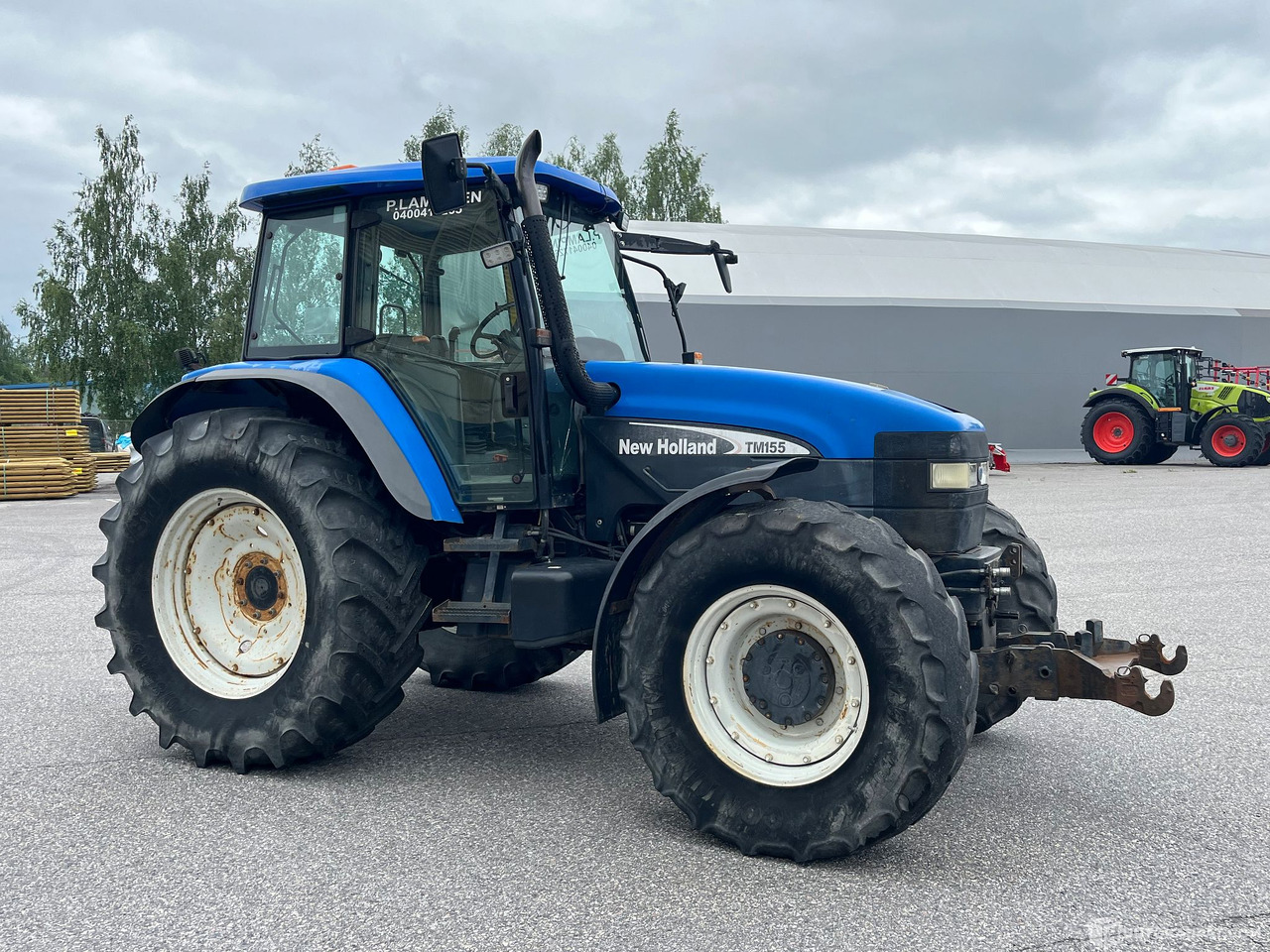 New Holland TM155, traktori etunostolaitteeella, 2004,, Salo - Machine agricole: photos 3 New Holland TM155, traktori etunostolaitteeella, 2004,, Salo - Machine agricole: photos 3
