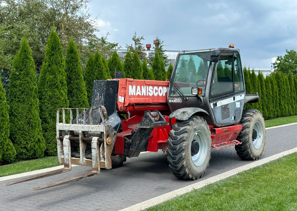 Manitou MT 1233S 12 M - Chariot télescopique: photos 1 Manitou MT 1233S 12 M - Chariot télescopique: photos 1