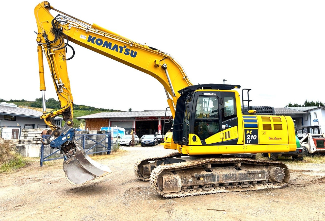 Komatsu PC210LC-11E0 - Pelle sur chenille: photos 1 Komatsu PC210LC-11E0 - Pelle sur chenille: photos 1