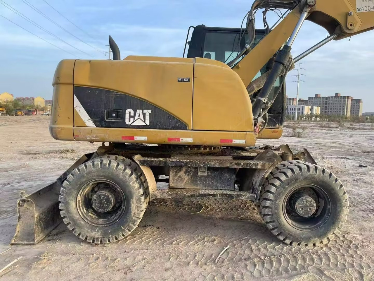 CATERPILLAR M315 - Pelle sur pneus: photos 1 CATERPILLAR M315 - Pelle sur pneus: photos 1