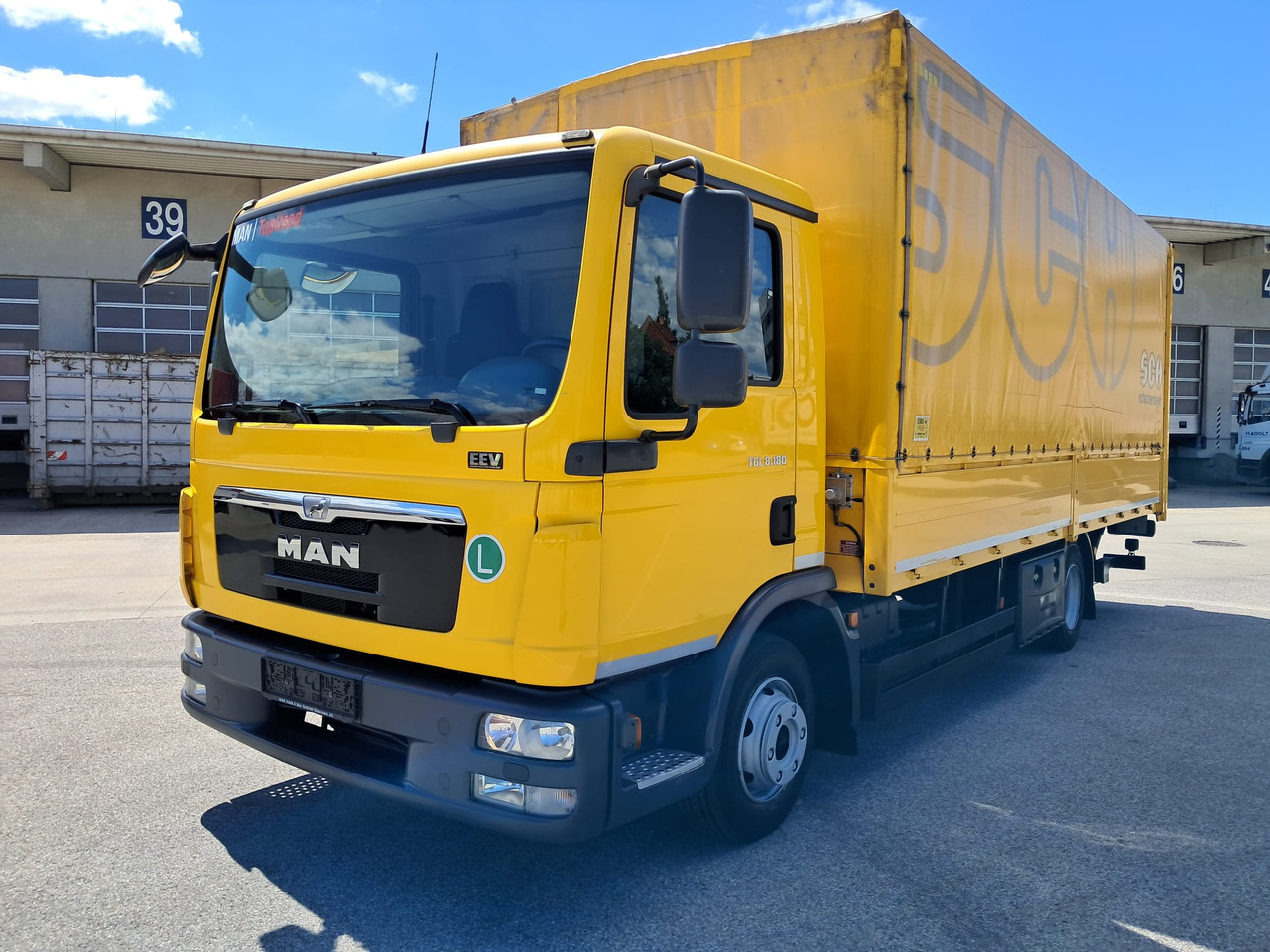MAN MAN TGL 8.180 Pritsche + LBW | Klima | Tempomat | Schaltgetriebe - Camion plateau: photos 1 MAN MAN TGL 8.180 Pritsche + LBW | Klima | Tempomat | Schaltgetriebe - Camion plateau: photos 1