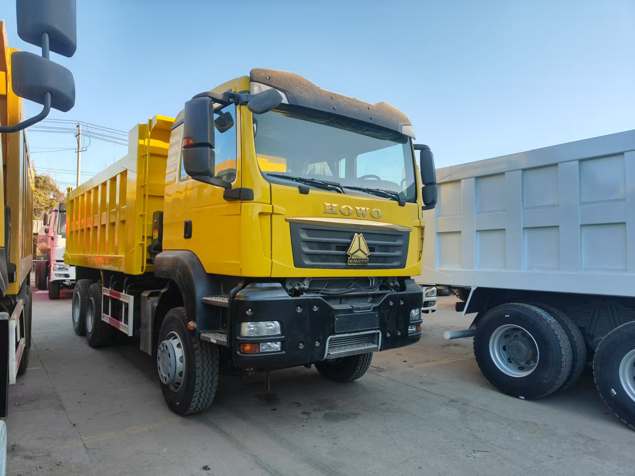 SINOTRUK T5G 6X4 CLICK HERE FOR DISCOUNT - Camion benne: photos 1 SINOTRUK T5G 6X4 CLICK HERE FOR DISCOUNT - Camion benne: photos 1