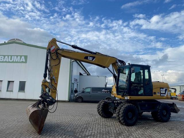 Cat M 313 D MIETE / RENTAL (12005587) - Pelle sur pneus: photos 1 Cat M 313 D MIETE / RENTAL (12005587) - Pelle sur pneus: photos 1
