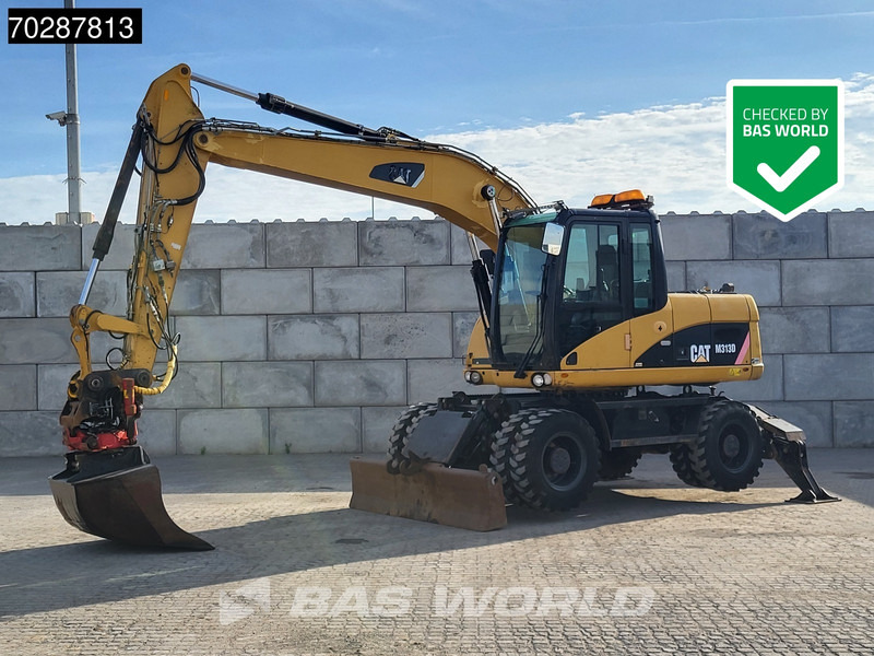 Caterpillar M313 D - Pelle sur pneus: photos 1 Caterpillar M313 D - Pelle sur pneus: photos 1
