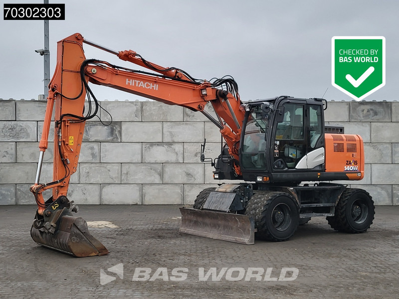 Hitachi ZX140W -6 - Pelle sur pneus: photos 1 Hitachi ZX140W -6 - Pelle sur pneus: photos 1