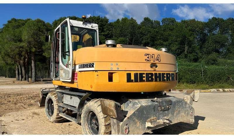 Liebherr A314 Litronic - Pelle sur pneus: photos 2 Liebherr A314 Litronic - Pelle sur pneus: photos 2