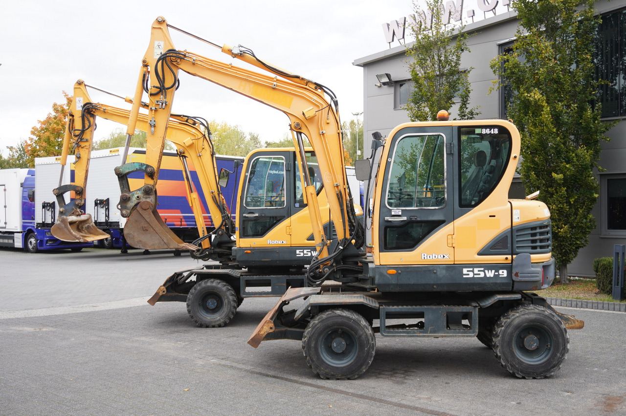 Hyundai Robex 55W-9 Wheeled Excavator 5.5t / 2pcs - Mini pelle: photos 1 Hyundai Robex 55W-9 Wheeled Excavator 5.5t / 2pcs - Mini pelle: photos 1