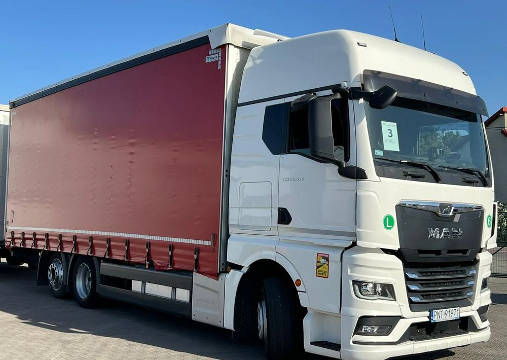 MAN TGX 26.470 z przyczepą Redos - Camion à rideaux coulissants: photos 3 MAN TGX 26.470 z przyczepą Redos - Camion à rideaux coulissants: photos 3