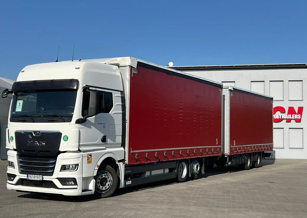MAN TGX 26.470 z przyczepą Redos - Camion à rideaux coulissants: photos 1 MAN TGX 26.470 z przyczepą Redos - Camion à rideaux coulissants: photos 1