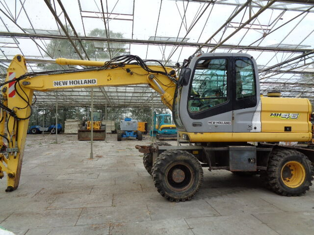 New Holland MH 4.6 - Pelle sur pneus: photos 1 New Holland MH 4.6 - Pelle sur pneus: photos 1