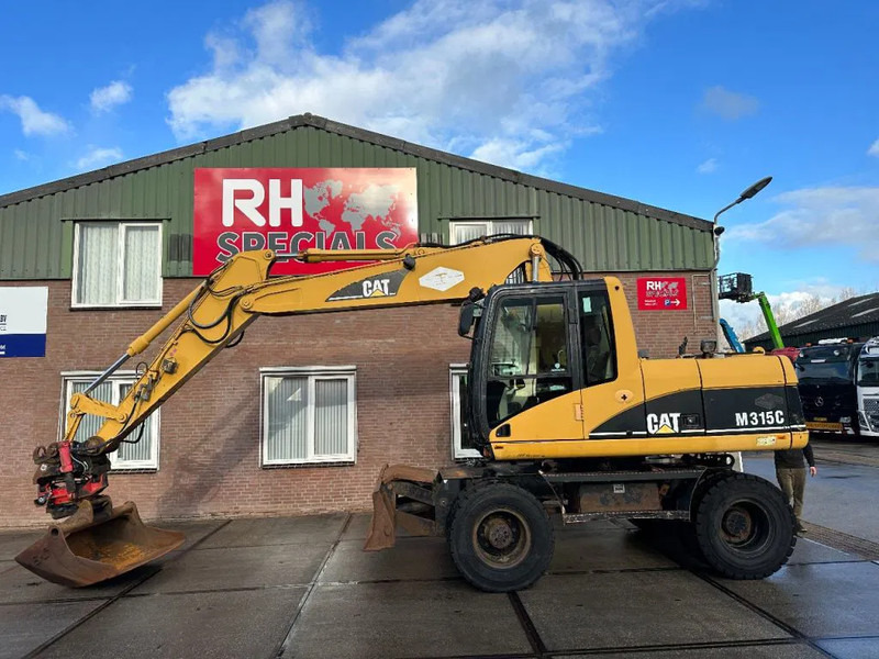 Caterpillar M315C WITH ROTOTILT, CE - Pelle sur pneus: photos 1 Caterpillar M315C WITH ROTOTILT, CE - Pelle sur pneus: photos 1
