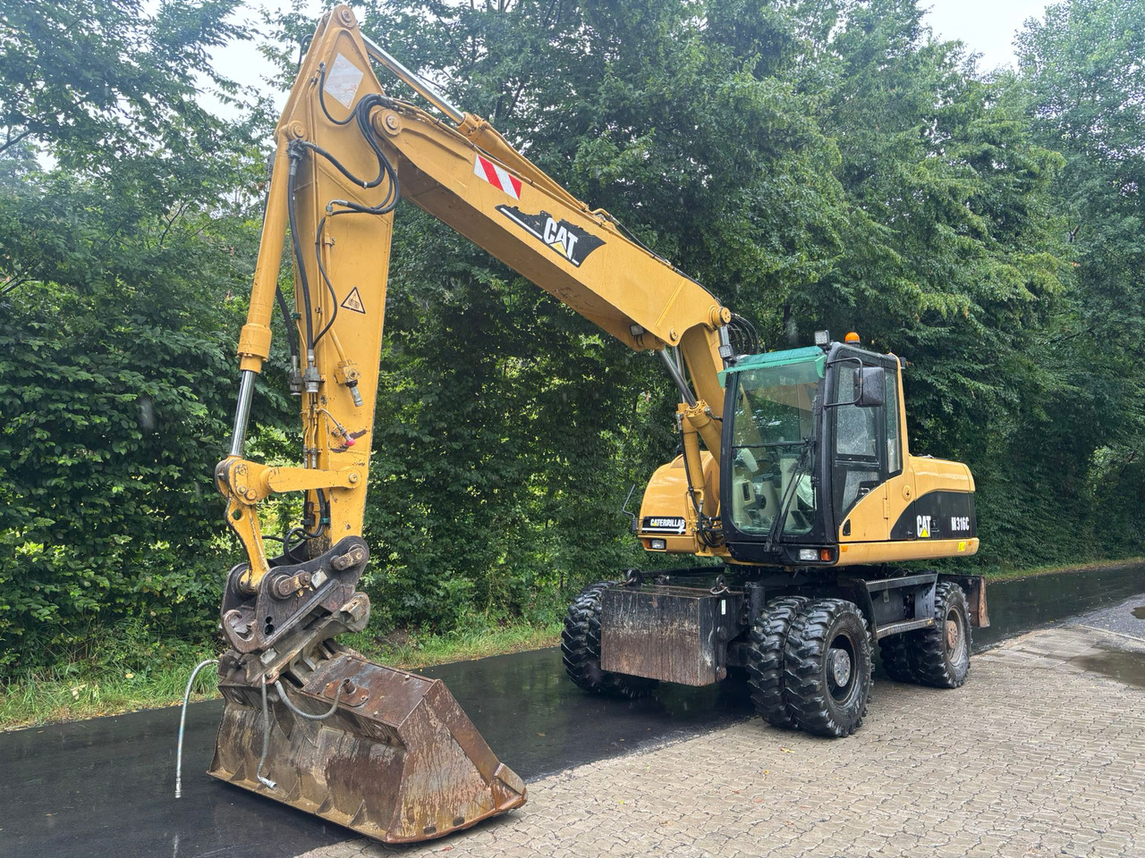 CATERPILLAR M 316 C - Pelle sur pneus: photos 3 CATERPILLAR M 316 C - Pelle sur pneus: photos 3