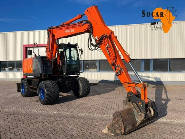 Hitachi ZX 140W-3 - Pelle sur pneus: photos 1 Hitachi ZX 140W-3 - Pelle sur pneus: photos 1
