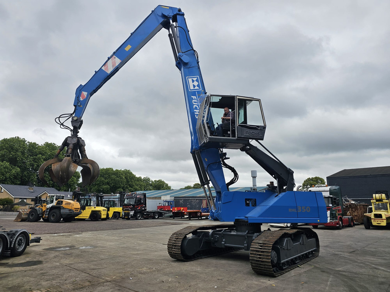 Fuchs RHL 350 Materialhandler With Adjustable Tracks - Pelle de manutention: photos 1 Fuchs RHL 350 Materialhandler With Adjustable Tracks - Pelle de manutention: photos 1