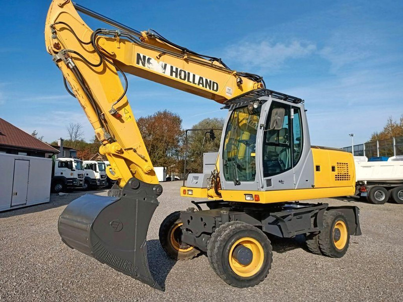 New Holland WE 190 - Pelle sur pneus: photos 1 New Holland WE 190 - Pelle sur pneus: photos 1