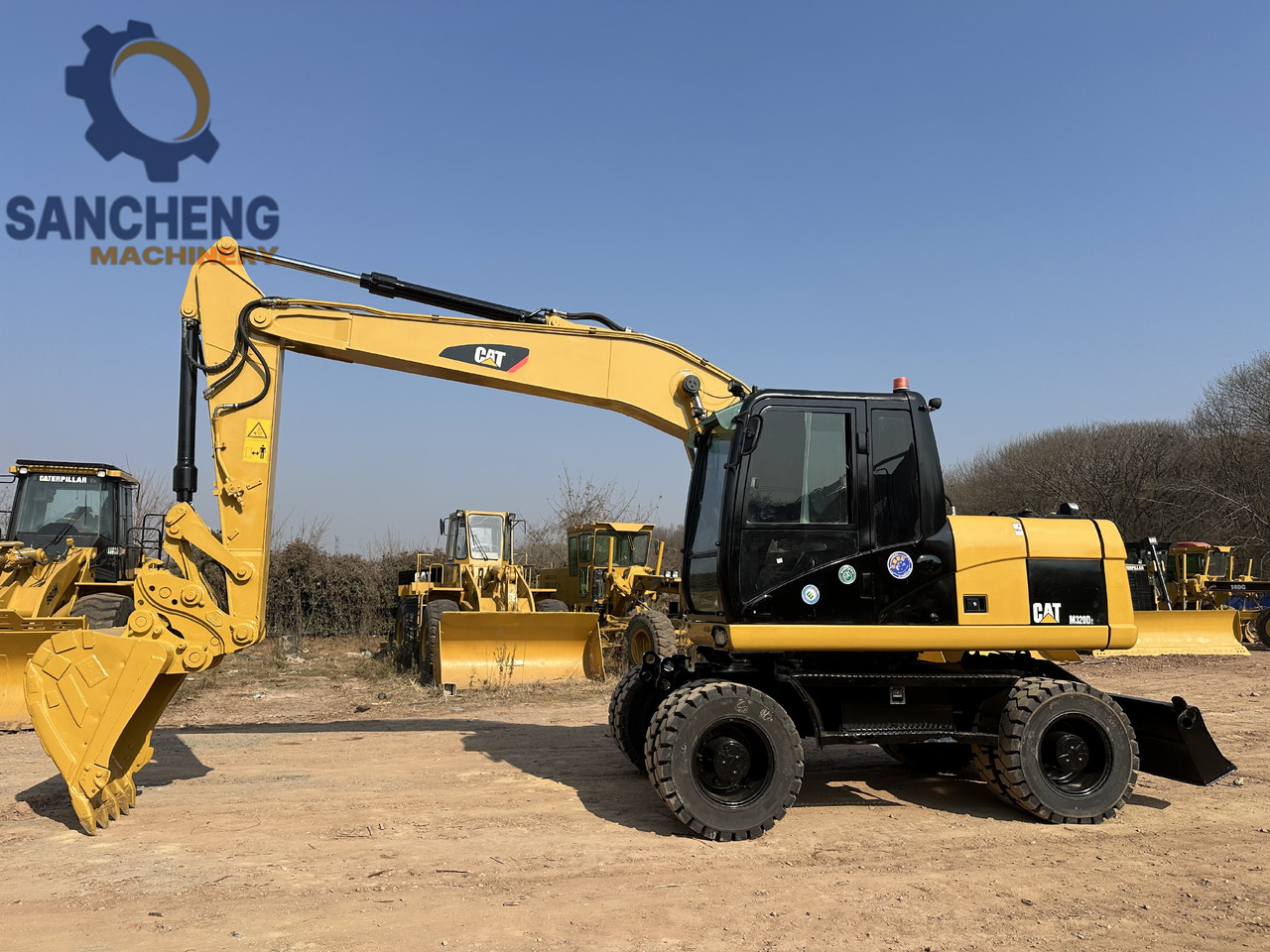 CATERPILLAR M320D2 - Pelle sur pneus: photos 5 CATERPILLAR M320D2 - Pelle sur pneus: photos 5