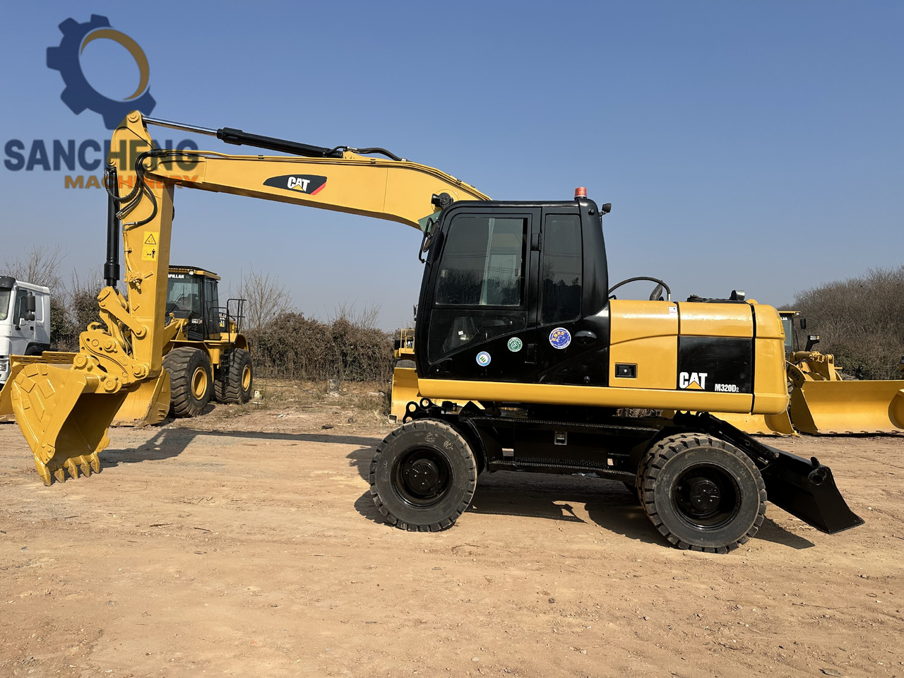 CATERPILLAR M320D2 - Pelle sur pneus: photos 2 CATERPILLAR M320D2 - Pelle sur pneus: photos 2