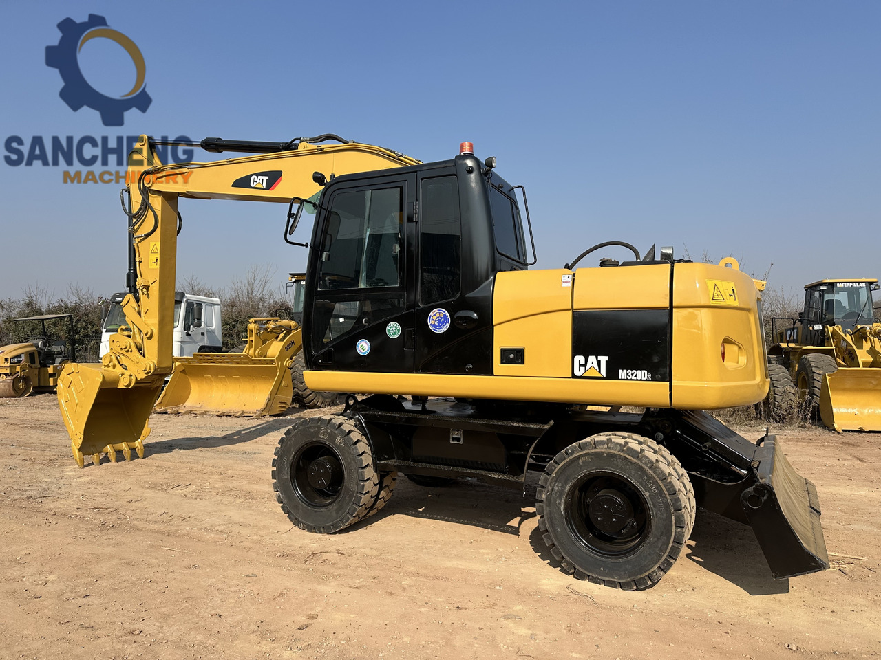 CATERPILLAR M320D2 - Pelle sur pneus: photos 1 CATERPILLAR M320D2 - Pelle sur pneus: photos 1