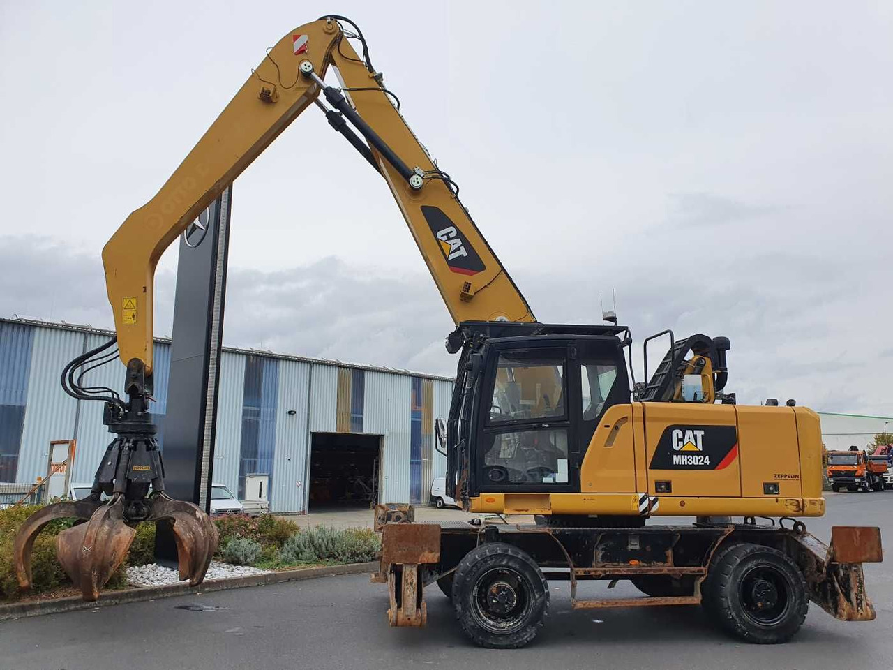 CAT MH3024 / MH 3024 / Greifer / 2018 / 9.424h - Pelle sur pneus: photos 3 CAT MH3024 / MH 3024 / Greifer / 2018 / 9.424h - Pelle sur pneus: photos 3