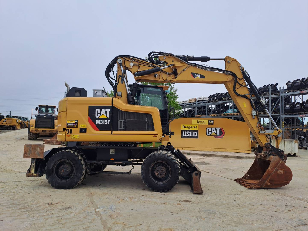 CAT M315F IVC - Pelle sur pneus: photos 1 CAT M315F IVC - Pelle sur pneus: photos 1