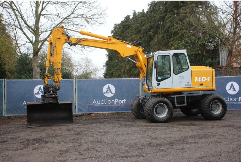 Atlas 1404 - Pelle sur pneus: photos 1 Atlas 1404 - Pelle sur pneus: photos 1